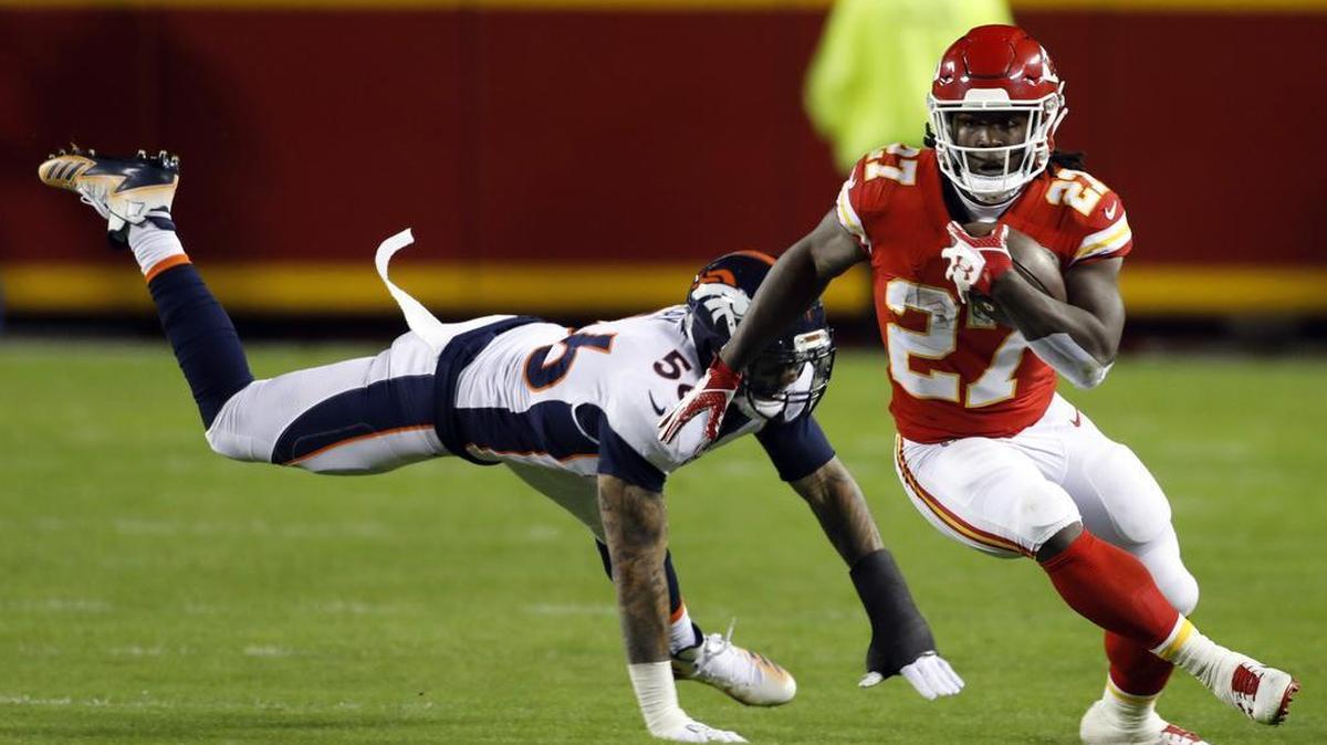 Kansas City Chiefs running back Kareem Hunt runs past Denver Broncos linebacker Shane Ray during Monday night’s game.