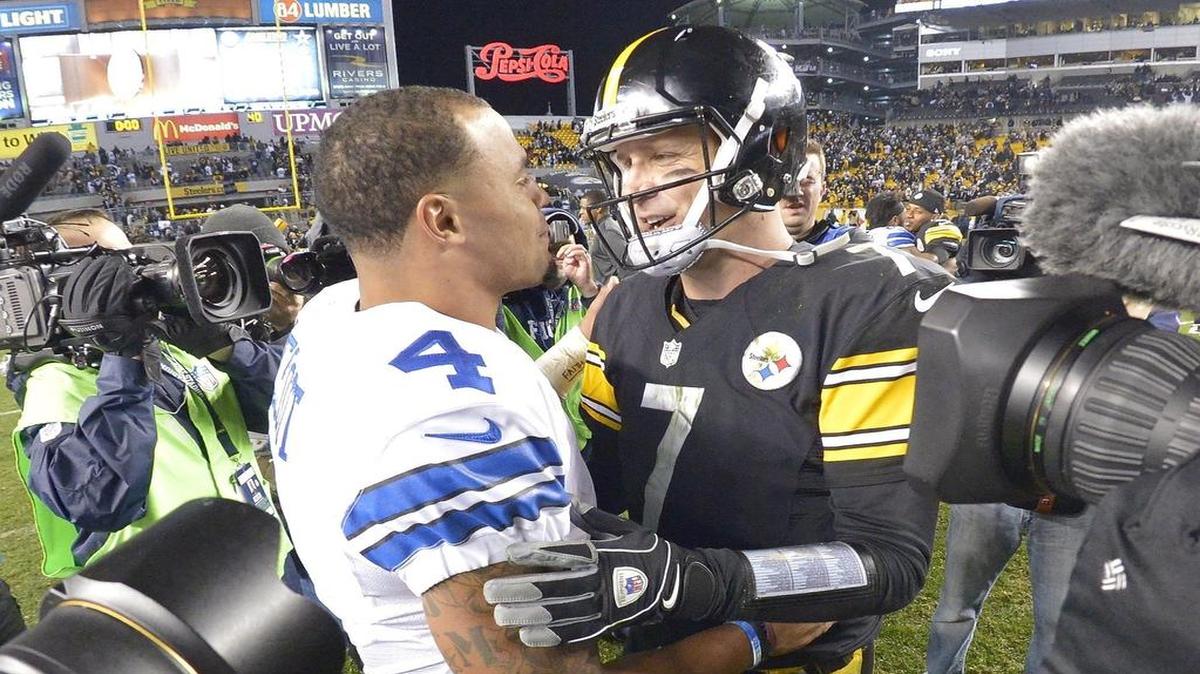 Dallas quarterback Dak Prescott and Pittsburgh quarterback Ben Roethlisberger visit after Sunday’s game won by the Cowboys 35-30.