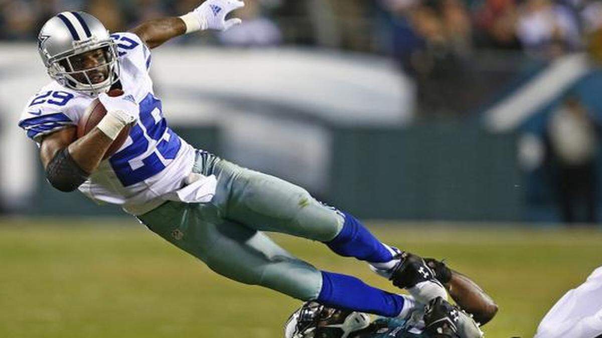 
 Cowboys running back DeMarco Murray  is caught by  Eagles free safety Malcolm Jenkins  in the first half. 
