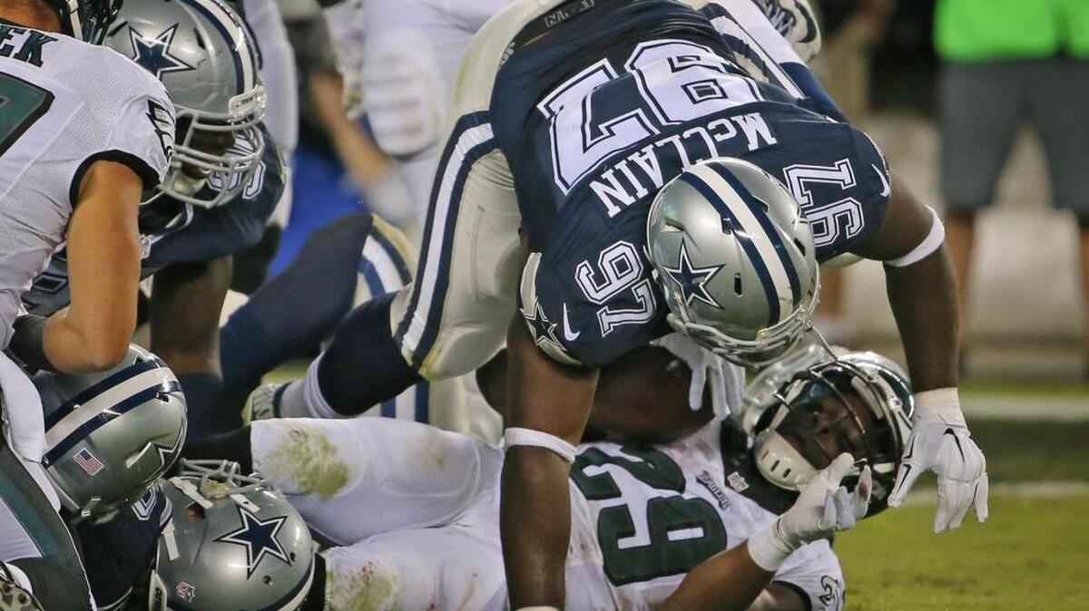 
Terrell McClain (97) greets Eagles running back DeMarco Murray (29) at the line in the fourth quarter Sunday.
