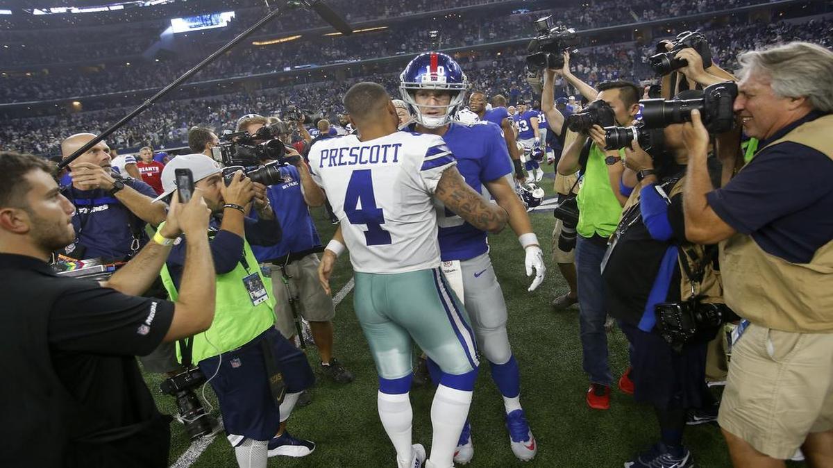 Cowboys quarterback Dak Prescott Giants quarterback Eli Manning talk after the Cowboys’ 19-3 win at AT&T Stadium Sunday night.