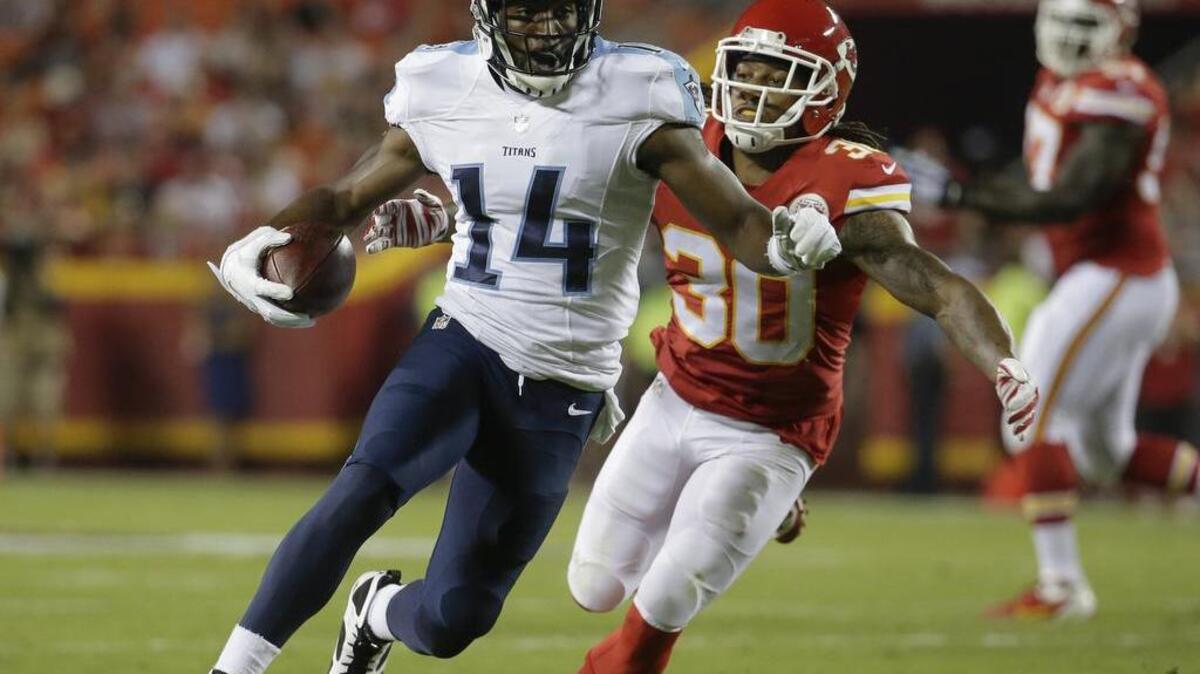 
Hakeem Nicks (14), who was cut by the Titans earlier this month, is one of the receivers working out for the Cowboys. 
