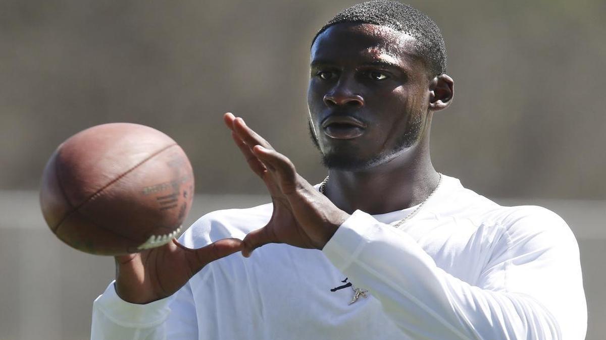 
Morris Claiborne catches balls from a launcher before practice at the Dallas Cowboys training camp in Oxnard, CA Friday, July 25, 2014.
