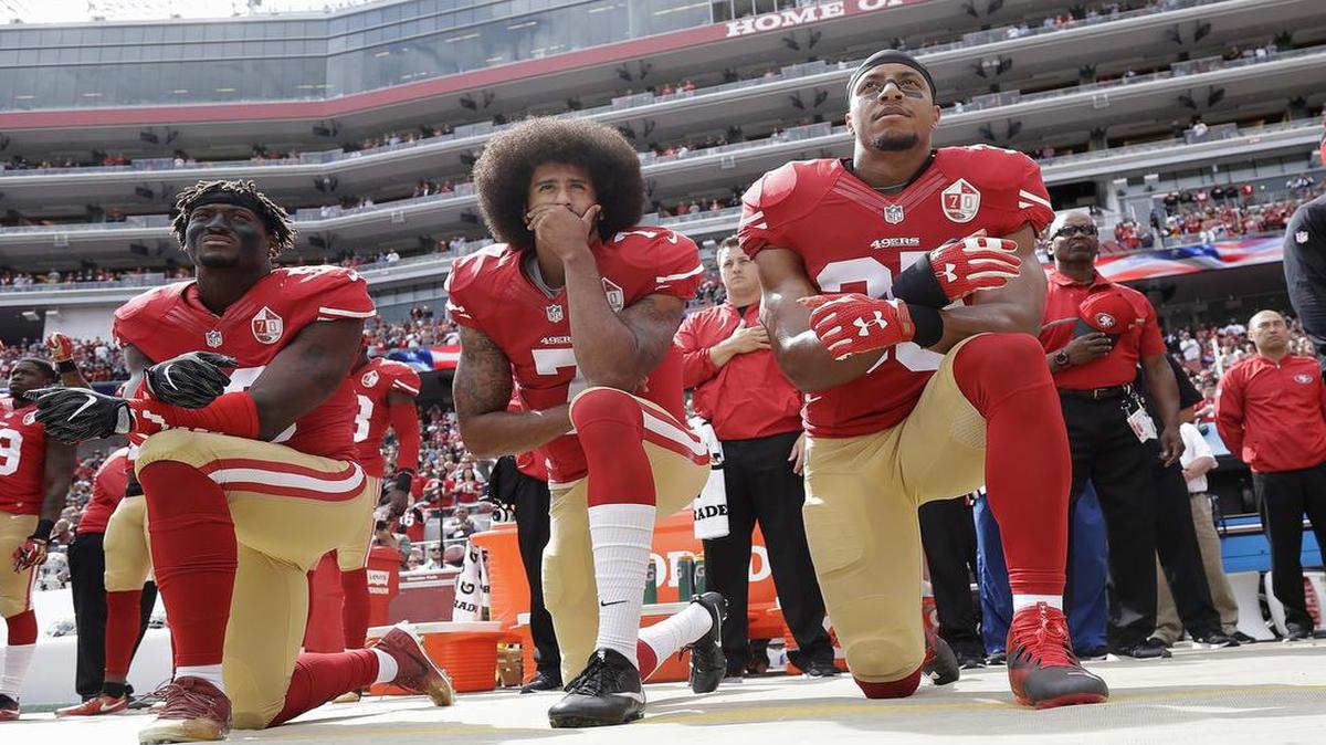Free-agent quarterback Colin Kaepernick, center, has not been signed, sparking a debate whether owners fear fan backlash over his protests last season during the national anthem.