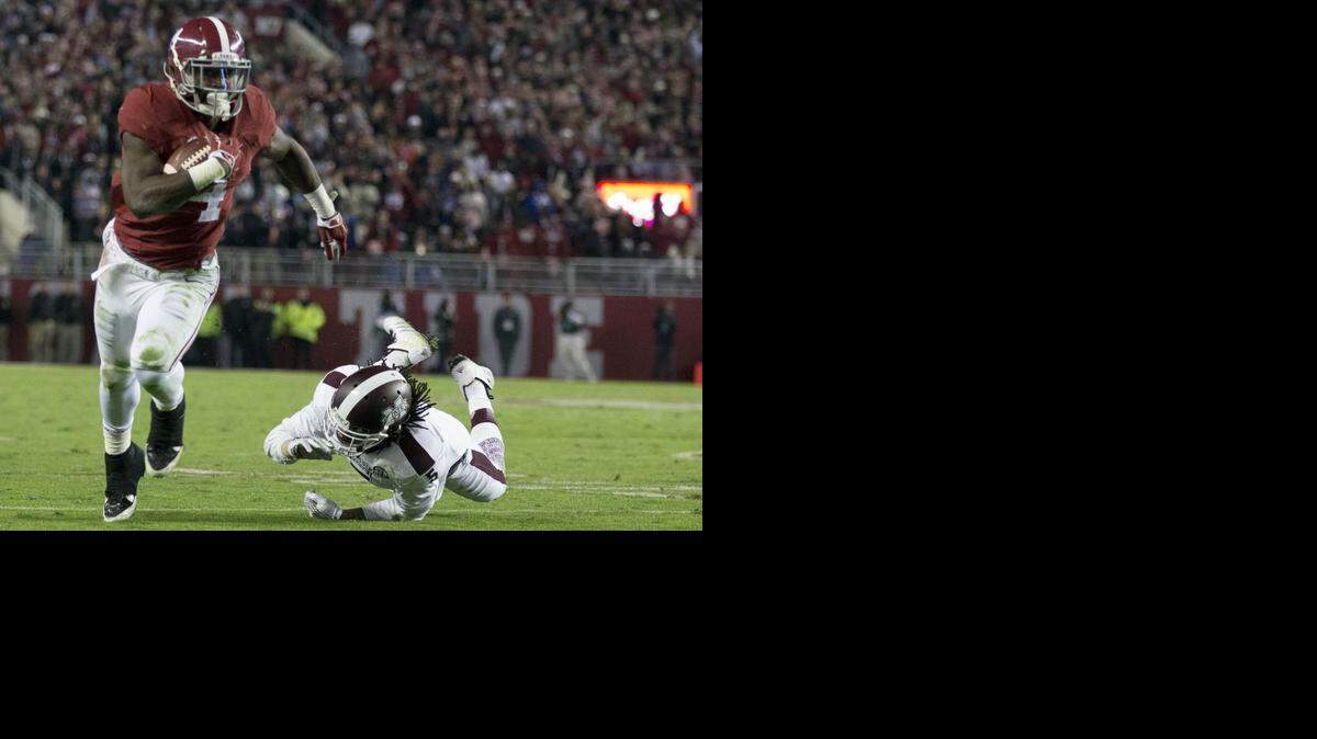 
Alabama running back T.J. Yeldon runs past Mississippi State in a game last season. 
