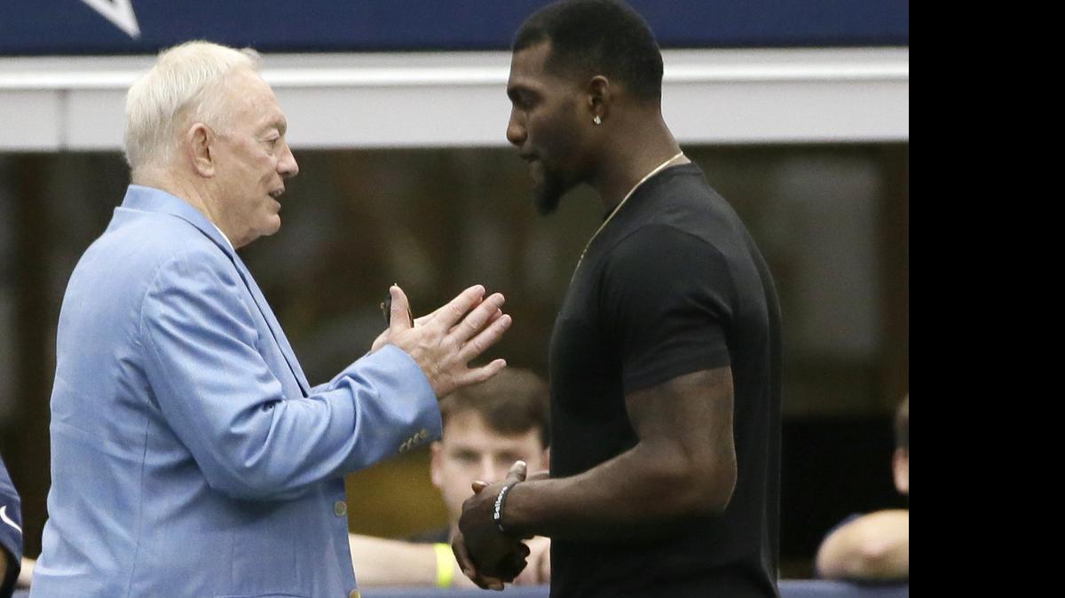 
Cowboys receiver Dez Bryant, right, listens to team owner Jerry Jones during the team’s minicamp last month. 

