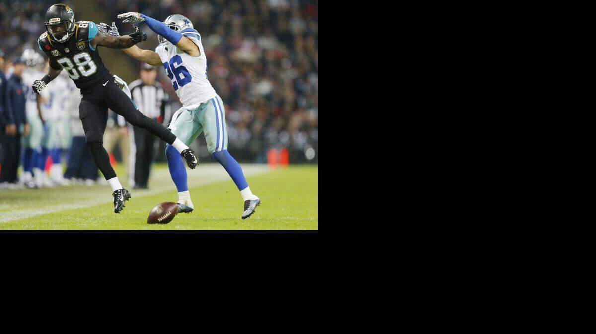 
Cowboys cornerback Sterling Moore defends against Jaguars receiver Allen Hurns during a game last season. 
