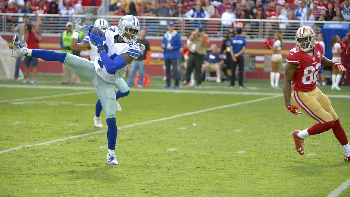 Cowboys cornerback Morris Claiborne intercepts a pass intended for 49ers receiver Keshawn Martin in the fourth quarter Sunday.