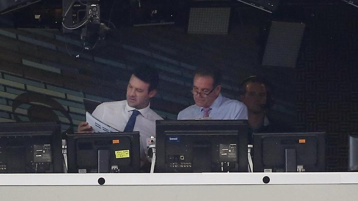 Former Dallas Cowboys quarterback and CBS commentator Tony Romo, left, talks with play-by-play announcer Jim Nantz before Sunday’s game at AT&T Stadium.