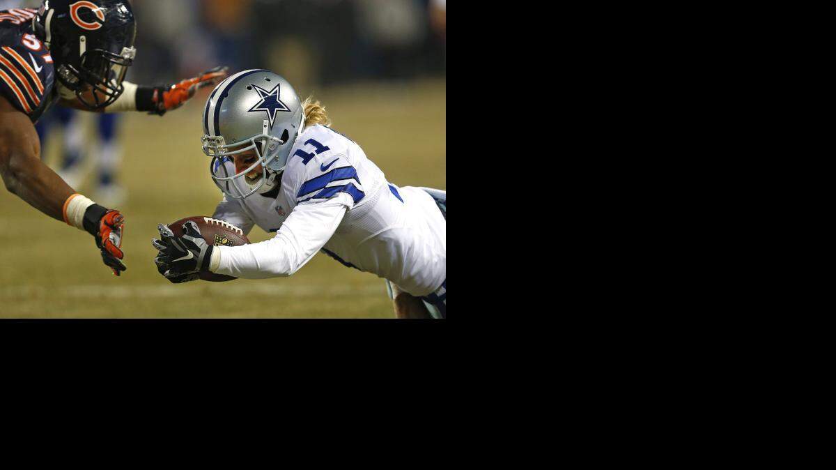 
Dallas Cowboys wide receiver Cole Beasley  takes a Tony Romo touchdown pass into the end zone to score  late in the second quarter last Thursday. Beasley has had to adjust to limited opportunities after being a 1,000-yard receiver each of his last two seasons at SMU. 
