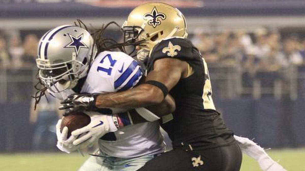 
Receiver Dwayne Harris makes a catch in front cornerback Corey White in a game between the Cowboys and Saints last season.
