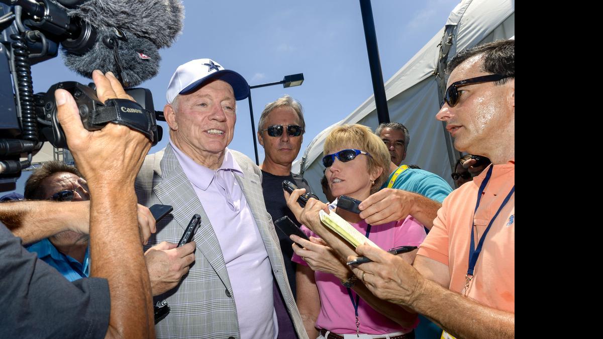 
Cowboys owner Jerry Jones, who had hip replacement surgery last week, leaves the opening press conference Wednesday. 
