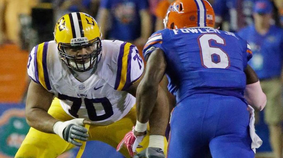 
LSU offensive tackle La'el Collins, left, was passed over in the NFL Draft after he was wanted for questioning in the death of his pregnant ex-girlfriend.
(
