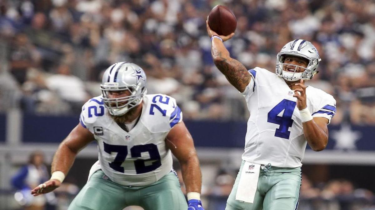Cowboys quarterback Dak Prescott, right, with protection from Travis Frederick, said he was mostly pleased with his debut performance but that “we’ve just got to score touchdowns down there in the red zone.”