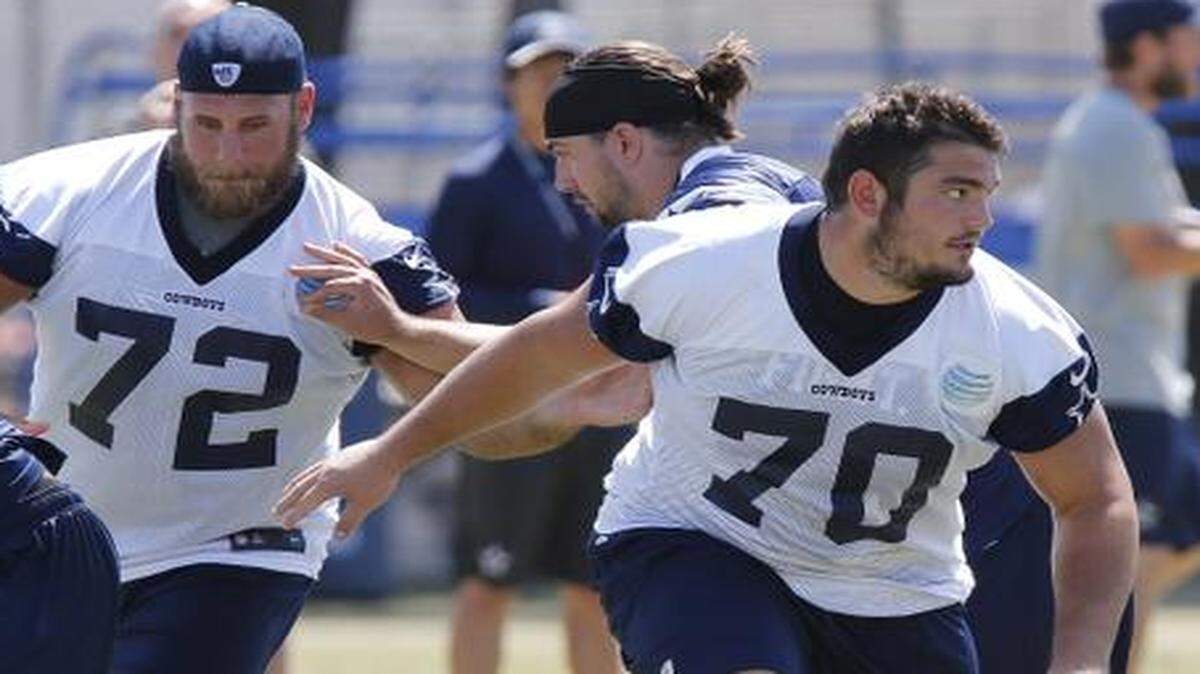 
Dallas Cowboys center Travis Frederick, left, and guard Zack Martin during a morning walkthrough at training camp in Oxnard, CA Thursday, July 31, 2014. 
