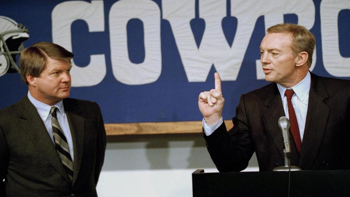 New Dallas Cowboys majority owner Jerry Jones, right, gestures as he speaks during a news conference at the team’s training facility in Irving, Texas, Feb. 28, 1989. New head coach Jimmy Johnson, left, listens.