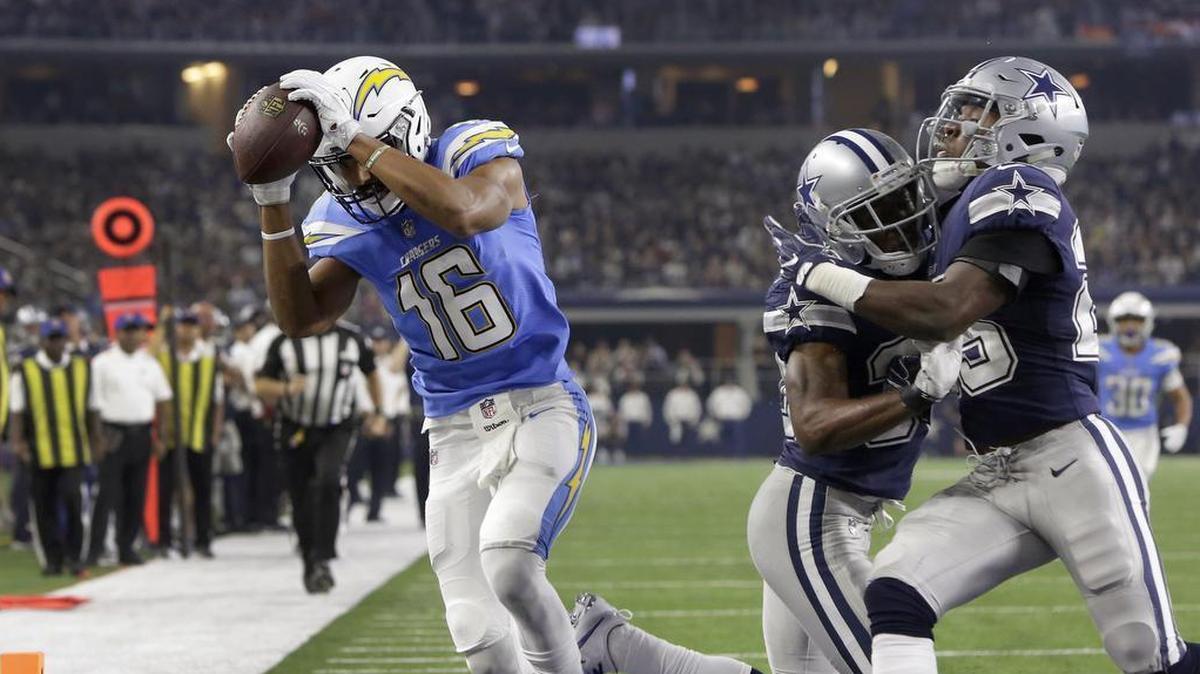 Cowboys cornerback Anthony Brown, center, running into teammate Xavier Woods as Chargers receiver Tyrell Williams scores on Thursday, has lost his starting job.