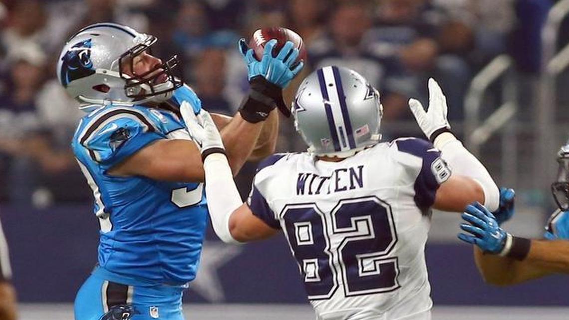 Panthers linebacker Luke Kuechly (59) picked off two passes, including this one intended for Jason Witten.