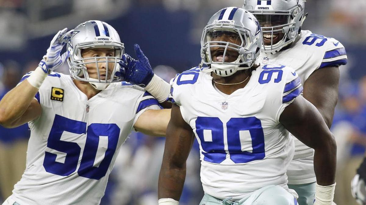 Dallas Cowboys defensive end DeMarcus Lawrence (90) celebrates sacking New York Giants quarterback Eli Manning, not pictured, with teammates outside linebacker Sean Lee (50) and defensive tackle Maliek Collins, back right, during the first half of an NFL football game in Arlington, Sunday, September 10, 2017.