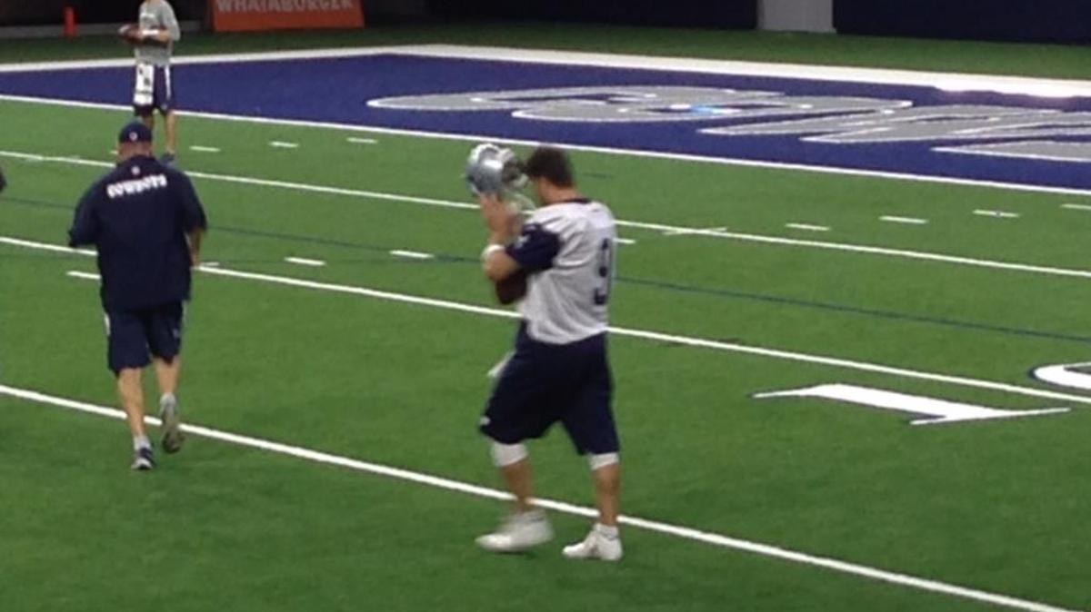 Tony Romo donned shells and a helmet and had a limited practice Thursday for the first time since injuring his back Aug. 25.