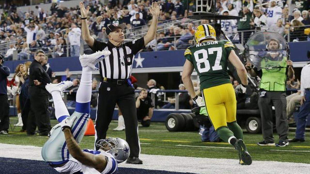 
Green Bay Packers receiver Jordy Nelson scored a touchdown against Dallas Cowboys cornerback Orlando Scandrick in December 2013.


