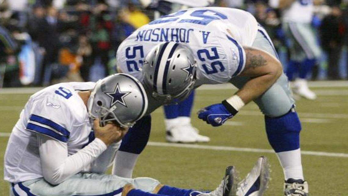 
Tony Romo is consoled by Al Johnson after a botched field-goal attempt in the Cowboys’ 21-20 loss to Seattle in 2007.
