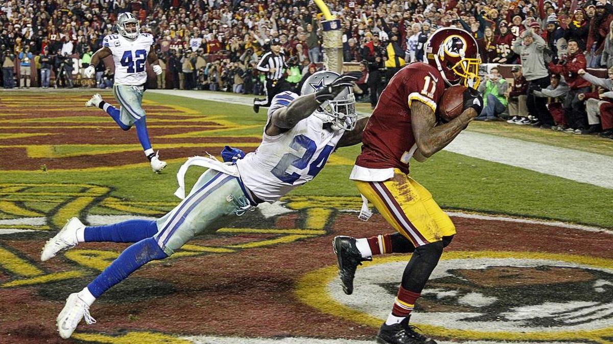 Redskins receiver DeSean Jackson hauls in a 28-yard touchdown pass against Cowboys cornerback Morris Claiborne (24) late in the fourth quarter.