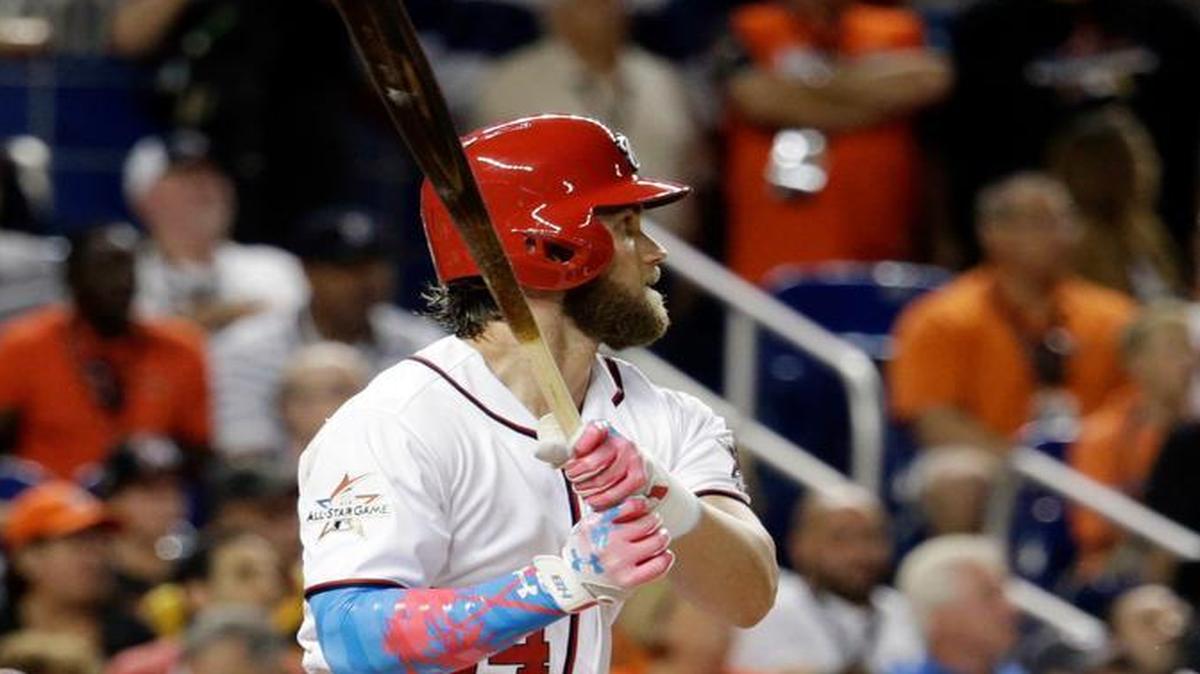National League’s Washington Nationals Bryce Harper (34,) singles to left field, during the first inning at the MLB baseball All-Star Game, Tuesday, July 11, 2017, in Miami.