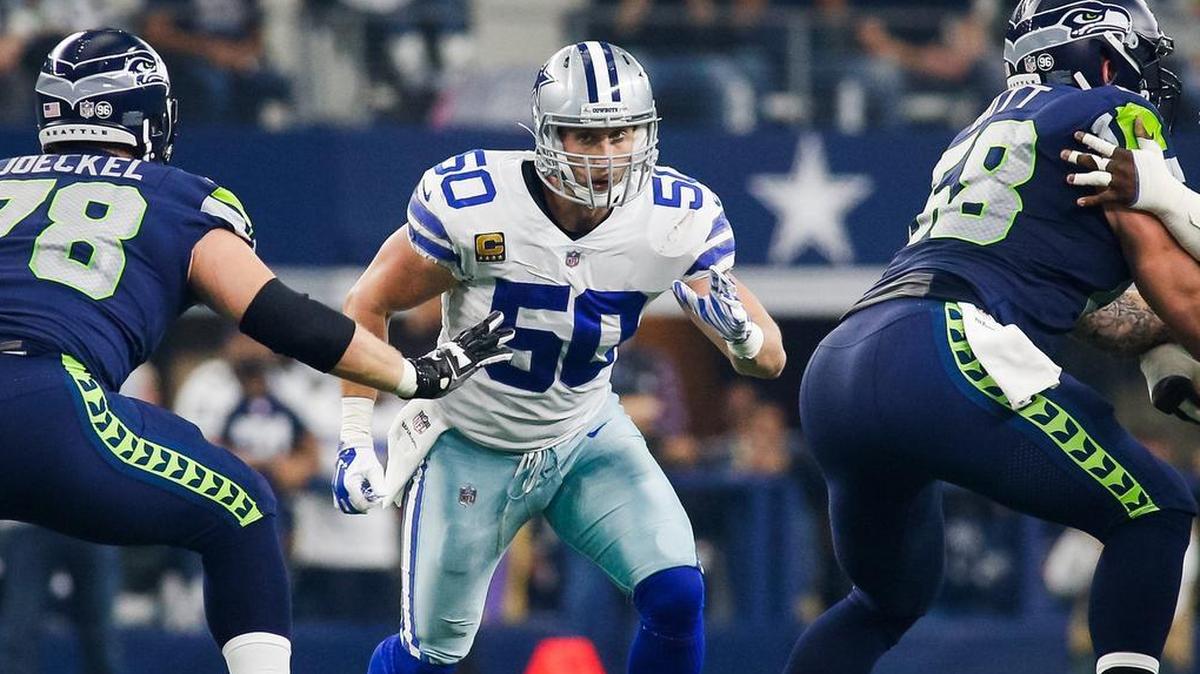 Dallas Cowboys linebacker Sean Lee runs through Seattle blockers while trying to make a play in the backfield.
