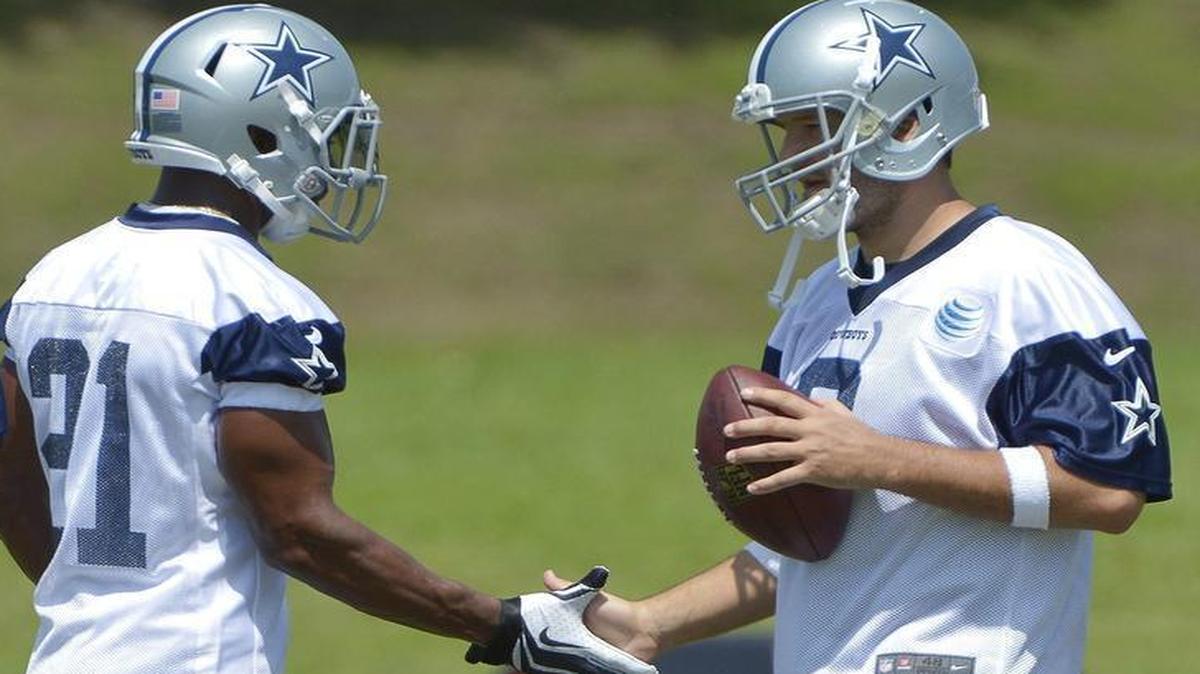 
Joseph Randle (21) and Tony Romo (9) during OTA practice at Valley Ranch in Irving, TX, Wednesday, May 27, 2015. 
