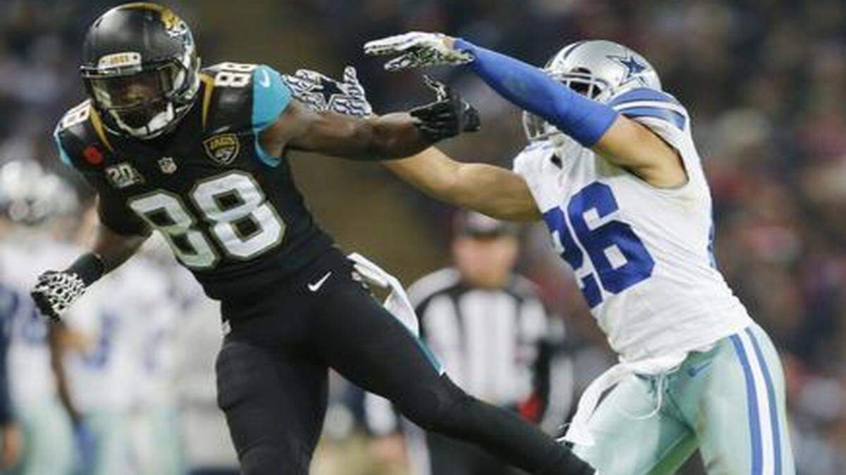 
Cowboys cornerback Sterling Moore defends against Jaguars receiver Allen Hurns during a game last season. 
