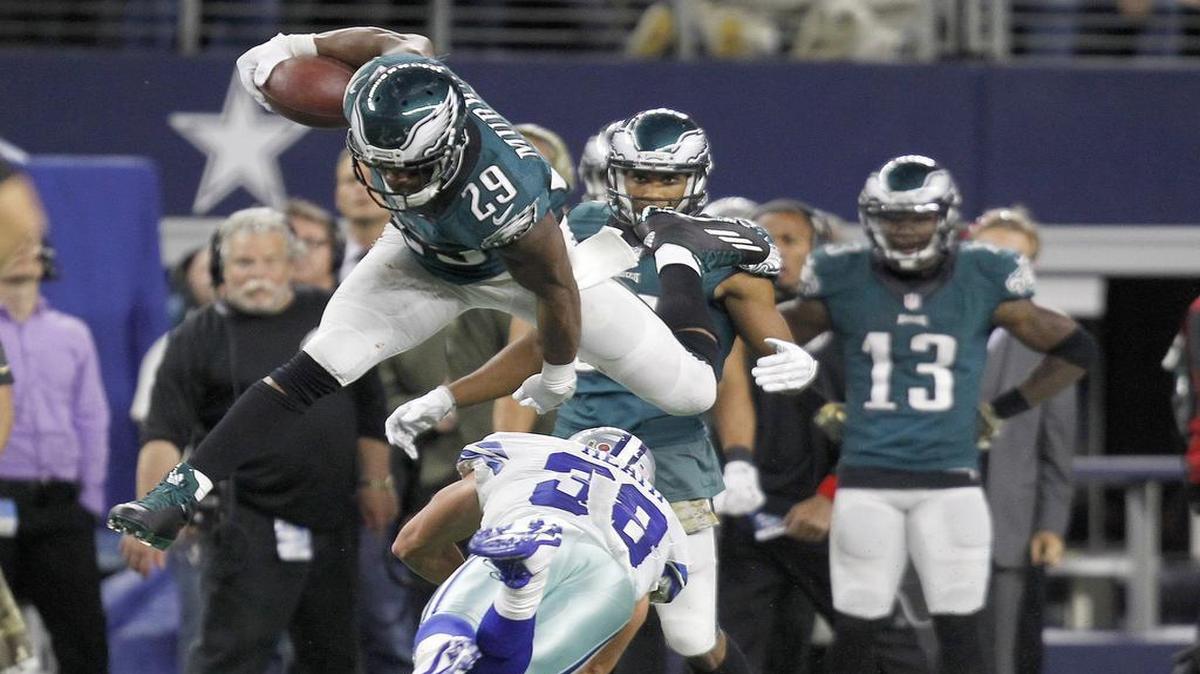 DeMarco Murray, leaping over Cowboys safety Jeff Heath, rushed for 83 yards on 18 carries Sunday.