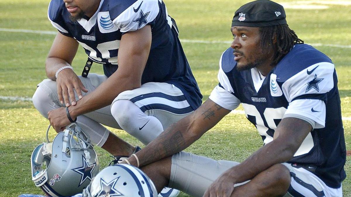 
Reserve defensive back Tyler Patmon (26), sitting with cornerback Brandon Carr (39), will get the first shot to replace the injured Orlando Scandrick in the slot.
