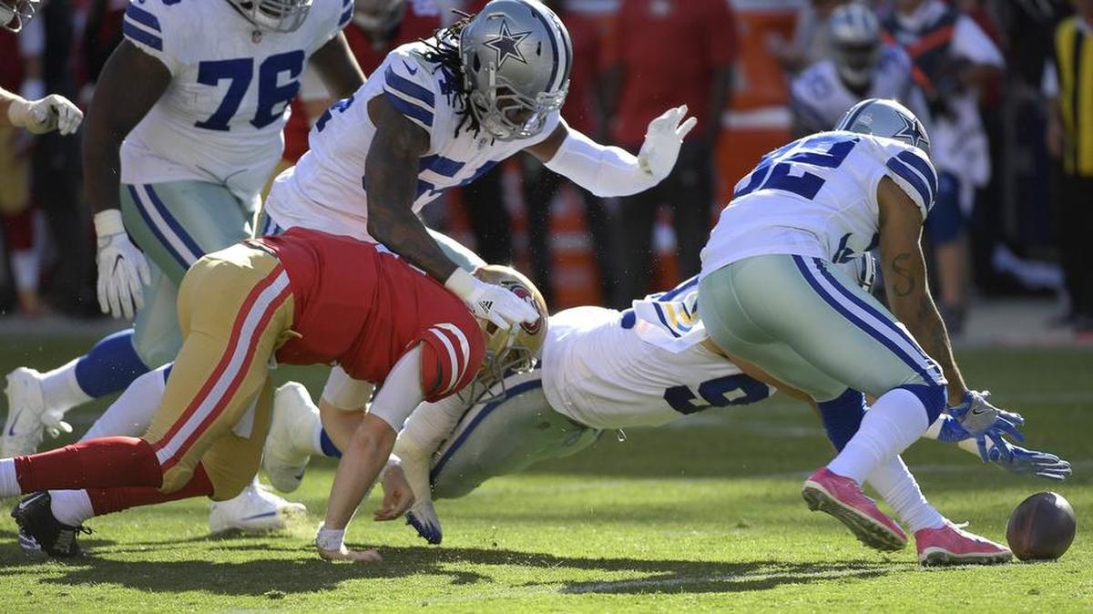Dallas Cowboys defensive end Tyrone Crawford and cornerback Orlando Scandrick go after the fumble caused by linebacker Jaylon Smith’s hit on San Francisco 49ers quarterback C.J. Beathard during the third quarter.