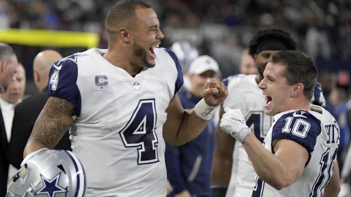 Dallas Cowboys quarterback Dak Prescott celebrates with wide receiver Ryan Switzer after Switzer's punt return .