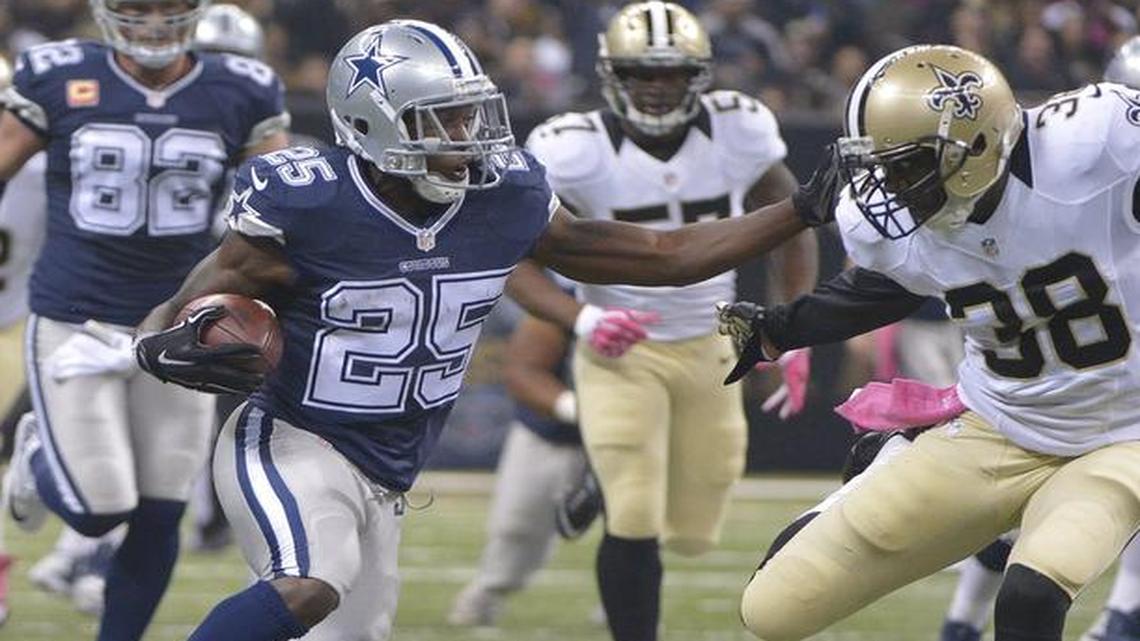 Running back Lance Dunbar (25) re-signed with the Dallas Cowboys after missing all but four games last season with a knee injury.