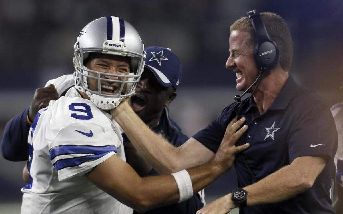 
Tony Romo’s late-game heroics brought smiles to Dallas Cowboys head coach Jason Garrett, right, and fans around the country.

