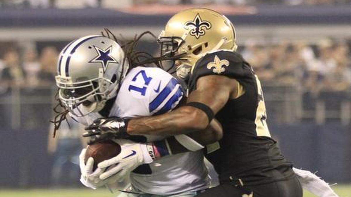 
Receiver Dwayne Harris makes a catch in front cornerback Corey White in a game between the Cowboys and Saints last season.
