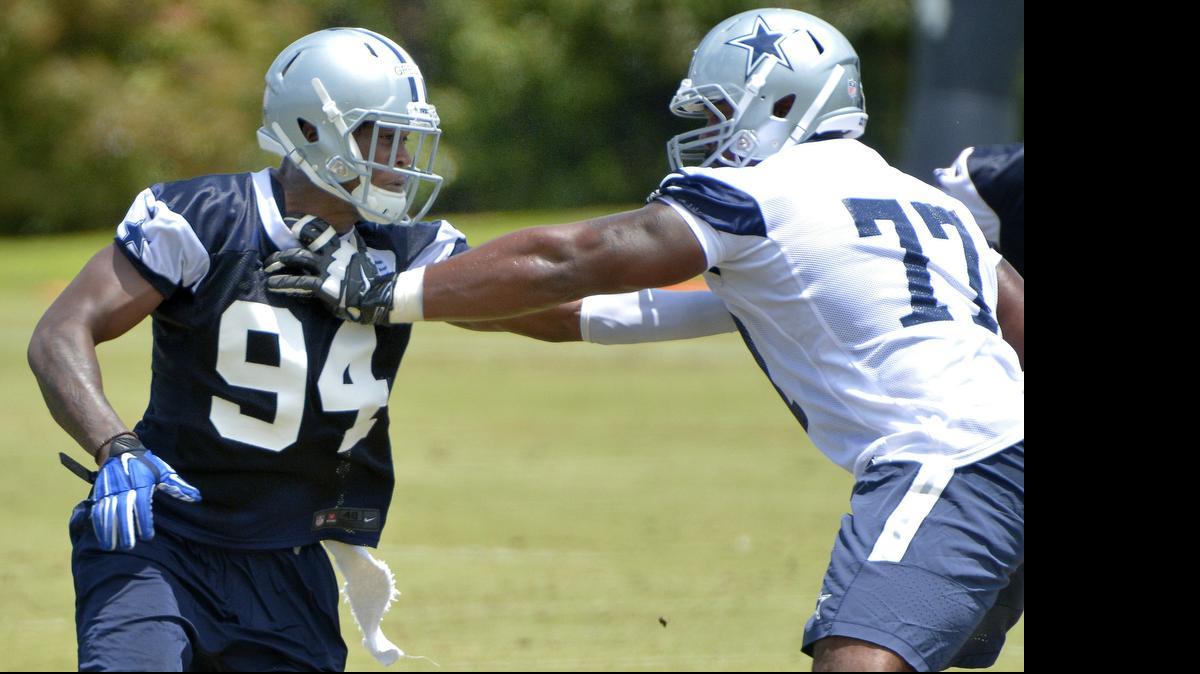 
Rookie Randy Gregory (94) goes against left tackle Tyron Smith (77) during Wednesday’s OTA.
