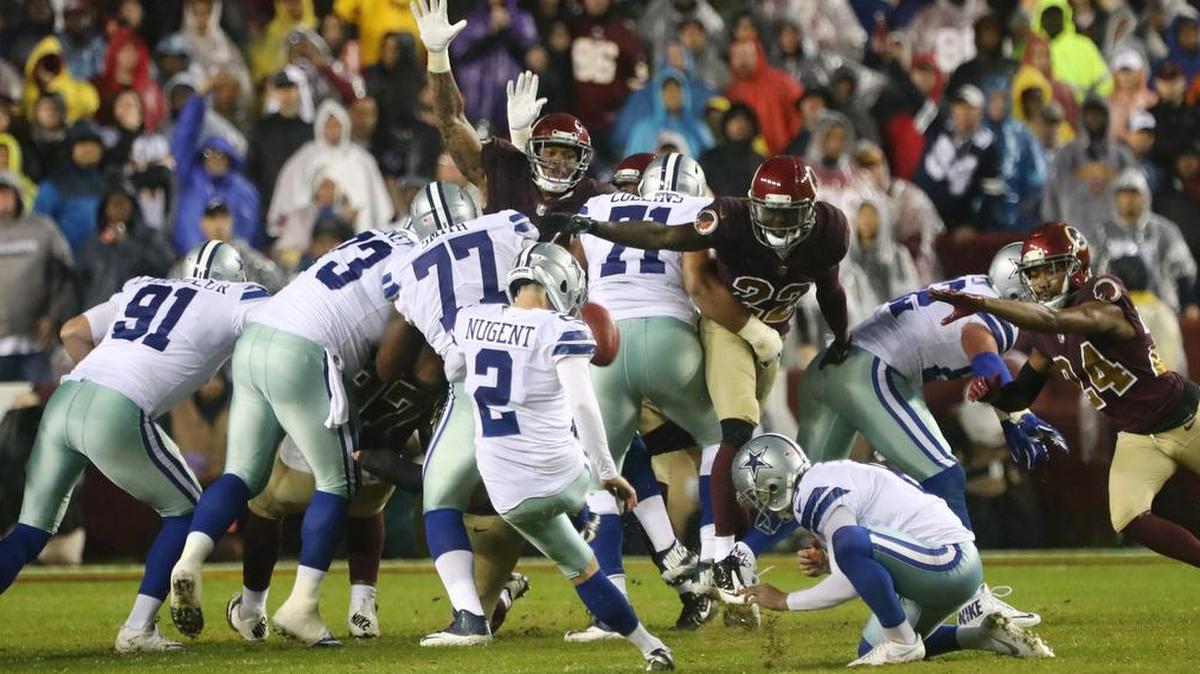 Mike Nugent (2) kicks a field goal as the Dallas Cowboys beat the Washington Redskins 33-19 at FedEx Field on Sunday.