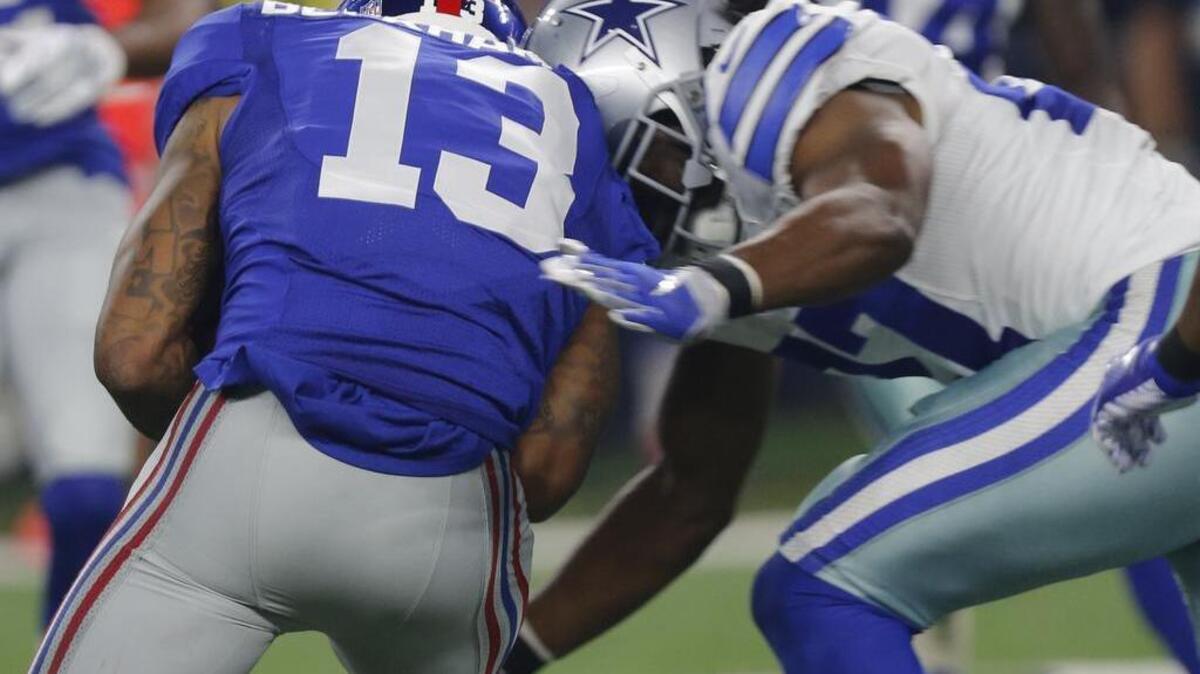 
J.J. Wilcox dislocated his nose on this hit against Giants receiver Odell Beckham Jr.
