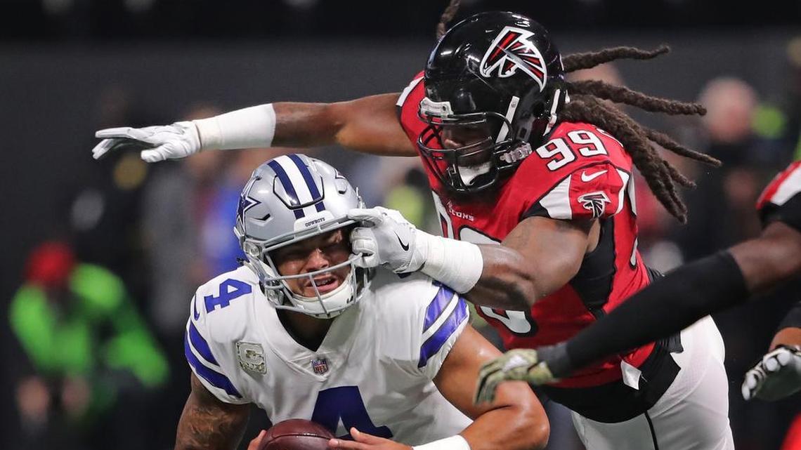 Dallas Cowboys quarterback Dak Prescott is sacked in the first quarter by Atlanta Falcons defensive end Adrian Clayborn.