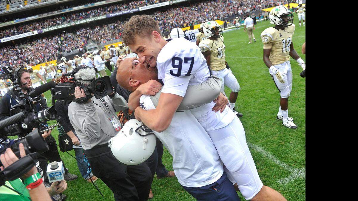 
Penn State kicker Sam Ficken is congratulated by his coach James Franklin after Ficken kicked the winning field goal to defeat Central Florida 26-24 in Dublin, Ireland, on Aug. 30. Ficken is considered one of the top specialists available in the draft.


