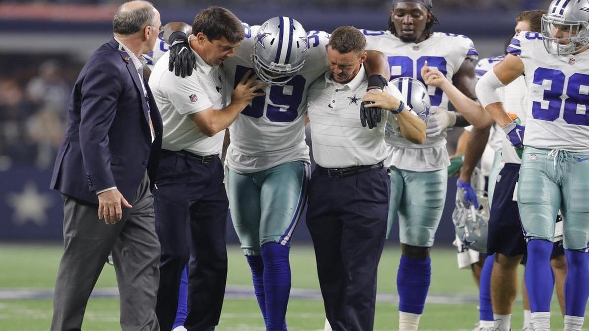 Dallas Cowboys middle linebacker Anthony Hitchens is forced to leave the game after an injury in the second quarter of a preseason game against the Oakland Raiders.
