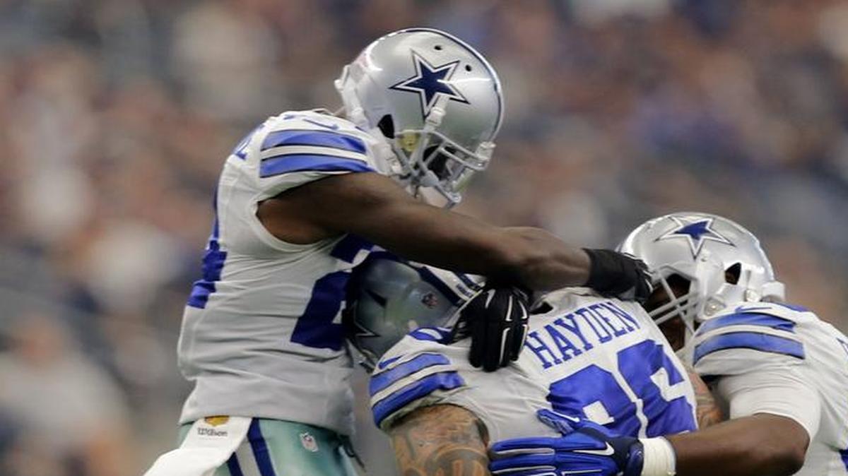 The Dallas Cowboys will be without Morris Claiborne, left, and Ryan Russell, second from right, when the host Carolina on Thanksgiving.