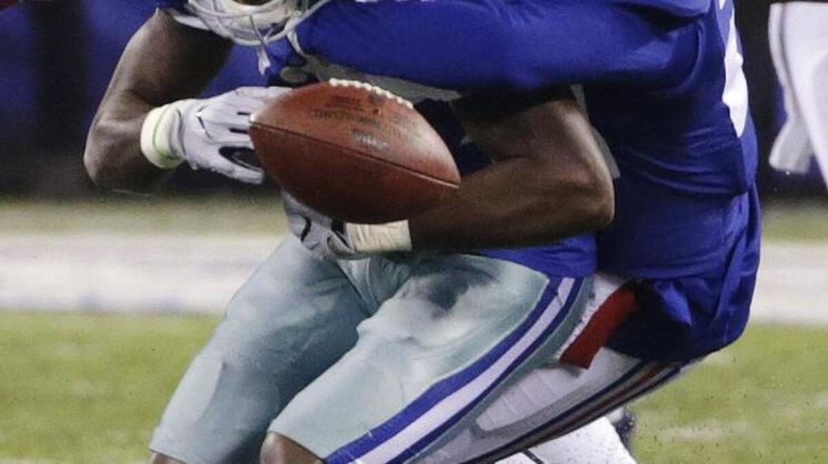 Giants cornerback Janoris Jenkins strips Cowboys receiver Dez Bryant late in the fourth quarter Sunday night.