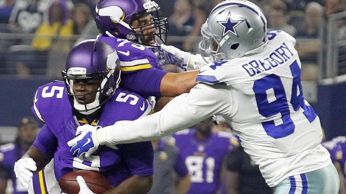 
Dallas Cowboys defensive end Randy Gregory gets to Minnesota Vikings quarterback Teddy Bridgewater (5) for his third sack in three preseason games.
