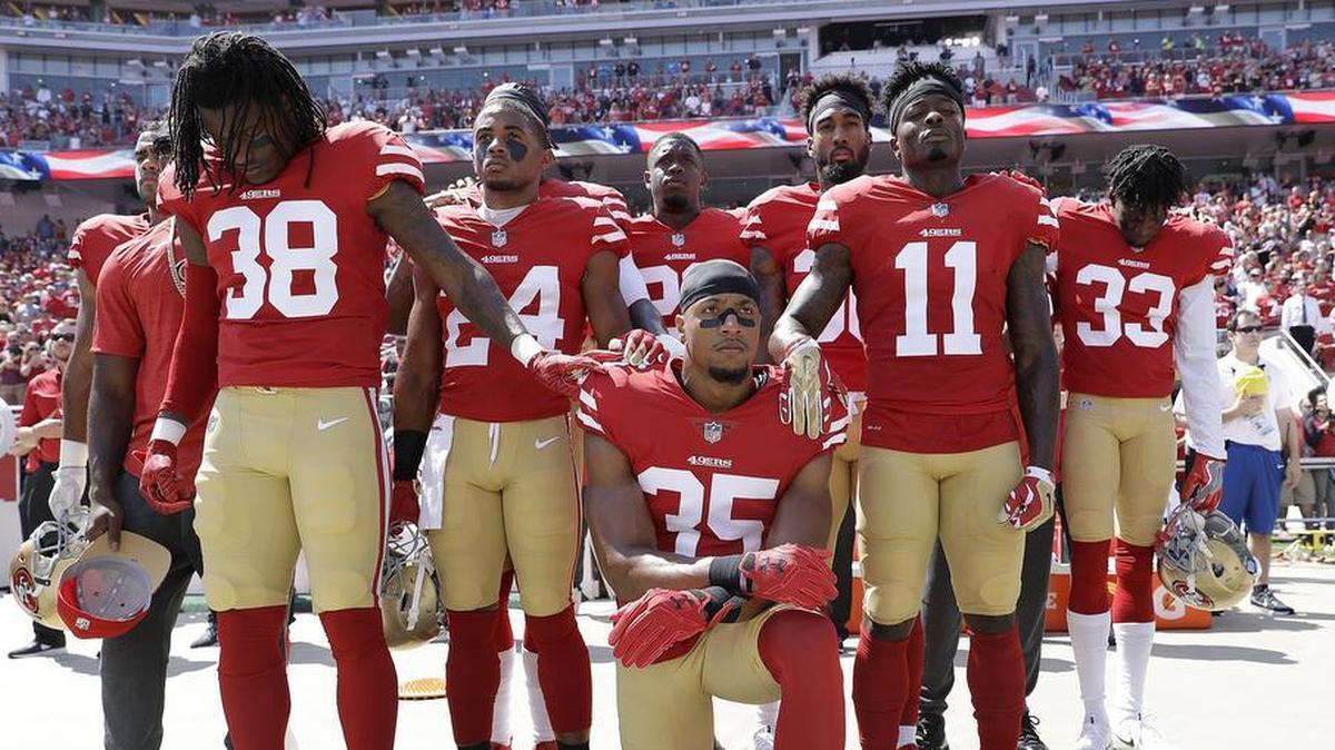 San Francisco 49ers safety Eric Reid (35) kneels during the national anthem alongside teammates on Sept. 10. The 49ers host the Dallas Cowboys on Sunday.
