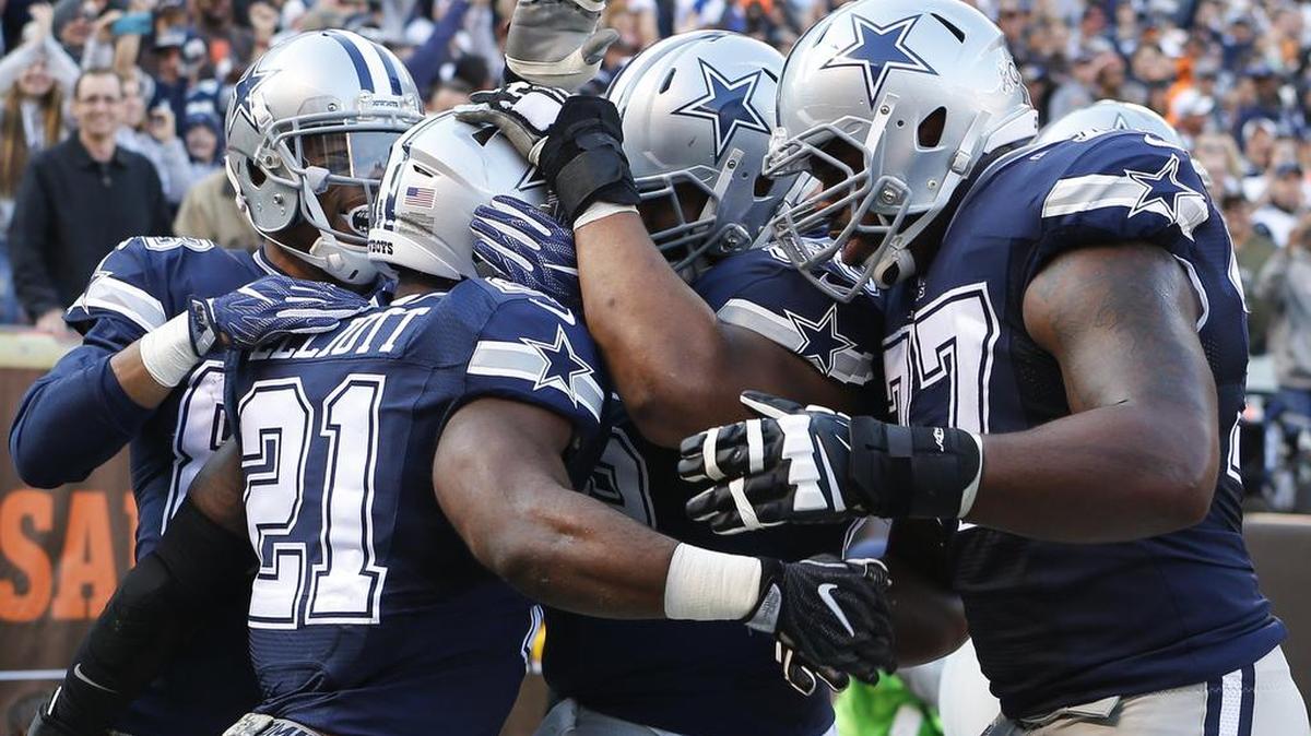 Ron Leary (65) celebrates a touchdown run by Ezekiel Elliott. Leary left the game in the fourth quarter with a head injury.
