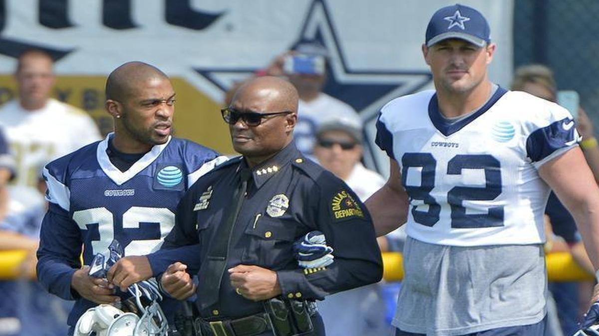 Cowboys’ Barry Church (42), Orlando Scandrick (32) and Jason Witten (82) escort Dallas police Chief David Brown onto the field Saturday.